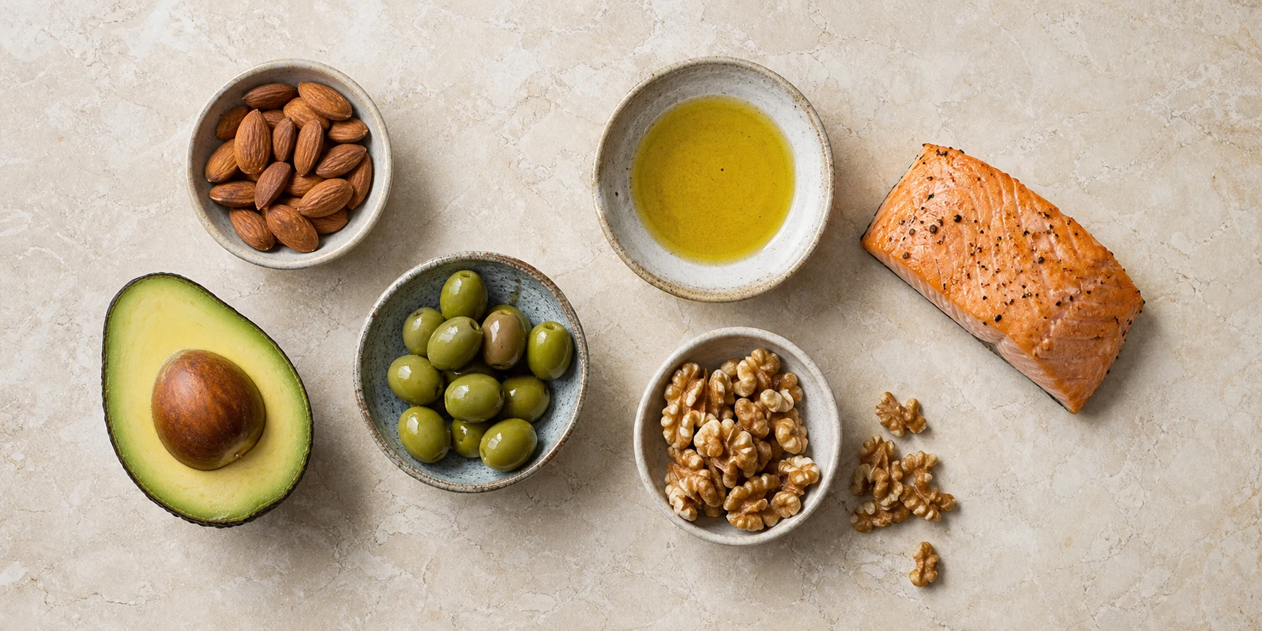 Several foods in ceramic bowls arranged for a neutral guide to reading source-reported fat values.